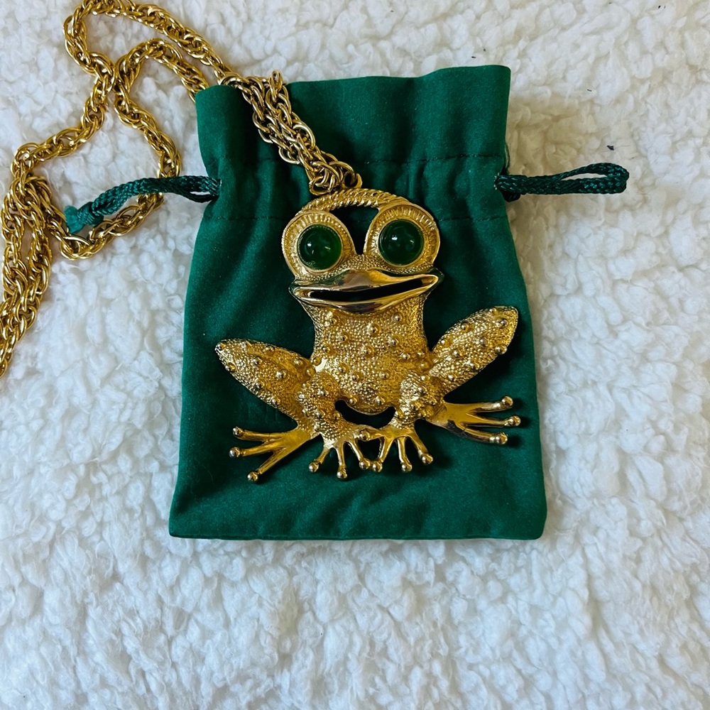 Whimsical gold tones happy frog necklace.